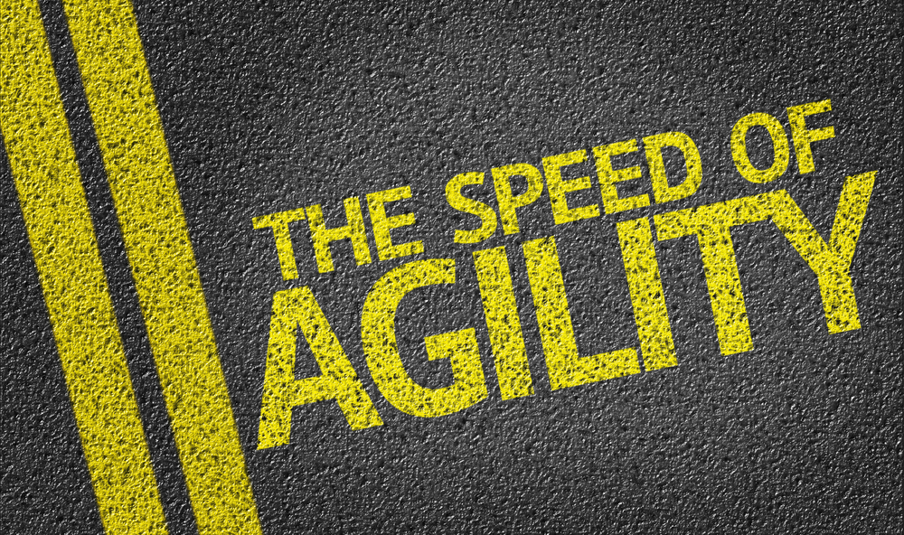 The Speed of Agility written on the road